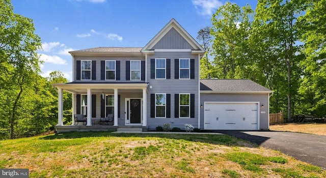12929 Pipe Run Dr, Fredericksburg, VA 22407 - view of front of house featuring asphalt driveway, a porch, an attached garage, and a front lawn