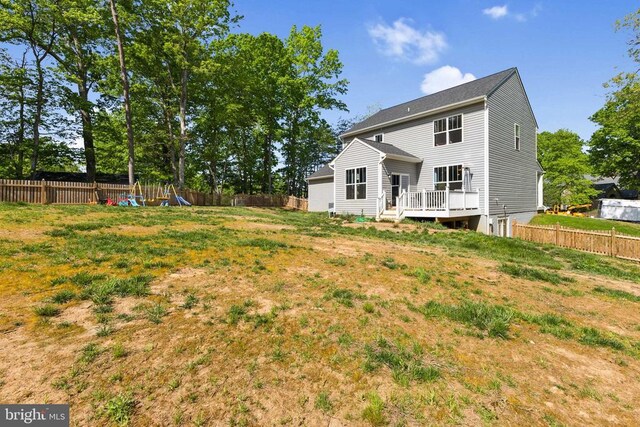 12929 Pipe Run Dr, Fredericksburg, VA 22407 - back of house with a wooden deck and a fenced backyard