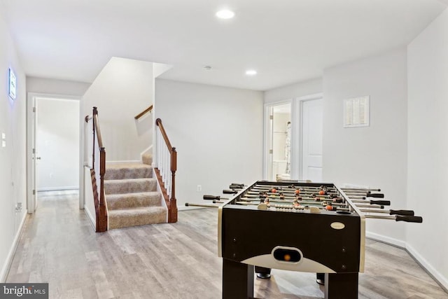recreation room with light wood finished floors, recessed lighting, and baseboards