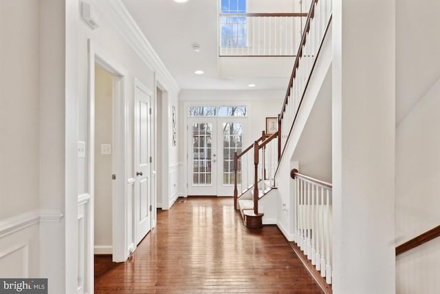 entrance foyer featuring wood-type flooring, stairway, french doors, recessed lighting, and baseboards