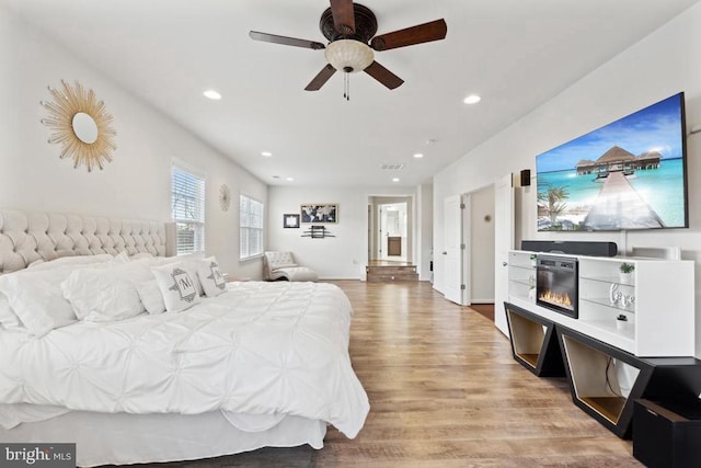 bedroom featuring wood finished floors, recessed lighting, and ceiling fan