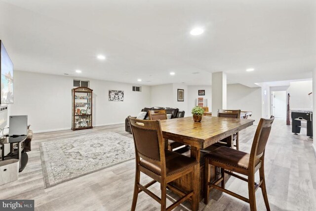 dining area featuring light wood-style floors and recessed lighting
