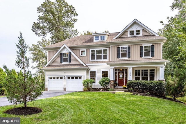 view of front of home featuring asphalt driveway, board and batten siding, a front lawn, and roof with shingles