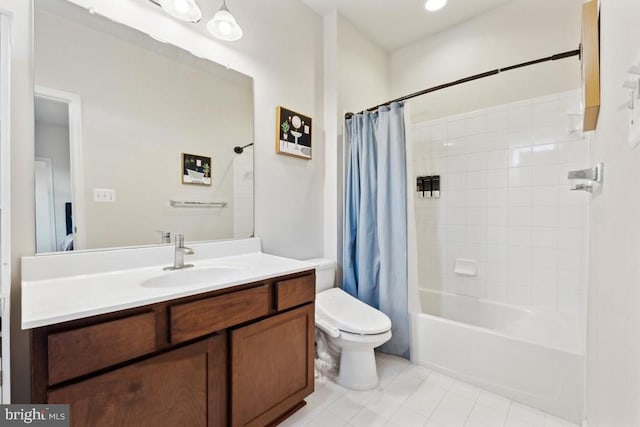 full bath with toilet, tile patterned flooring, vanity, and shower / tub combo