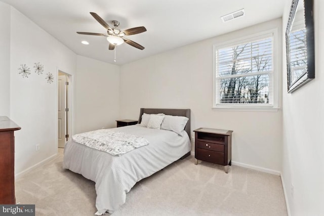bedroom with baseboards, light colored carpet, and ceiling fan