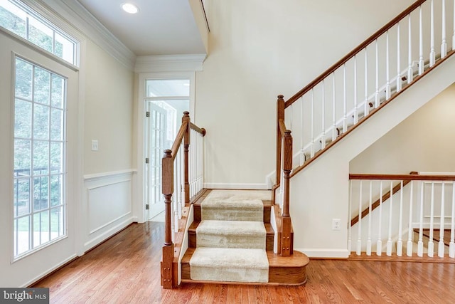 staircase with wood finished floors