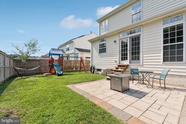 12314 Osprey Ln, Culpeper, VA 22701 - fenced backyard with a playground, a patio, and entry steps