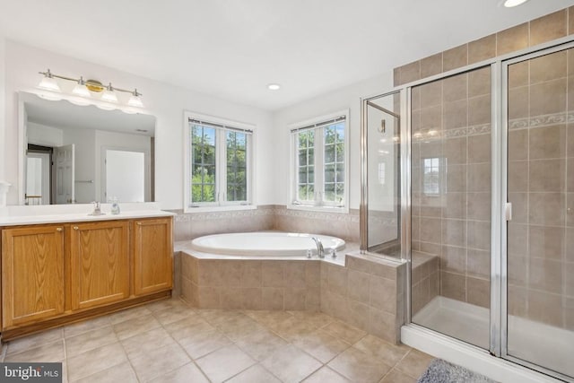12314 Osprey Ln, Culpeper, VA 22701 - full bathroom with vanity, a garden tub, a shower stall, tile patterned floors, and recessed lighting