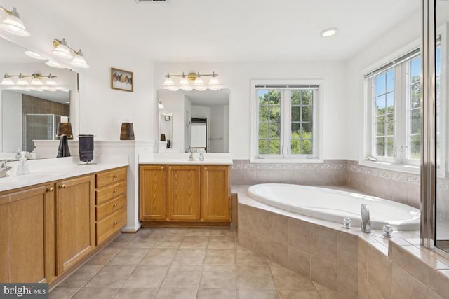 12314 Osprey Ln, Culpeper, VA 22701 - bathroom featuring two vanities, a stall shower, a bath, tile patterned floors, and recessed lighting