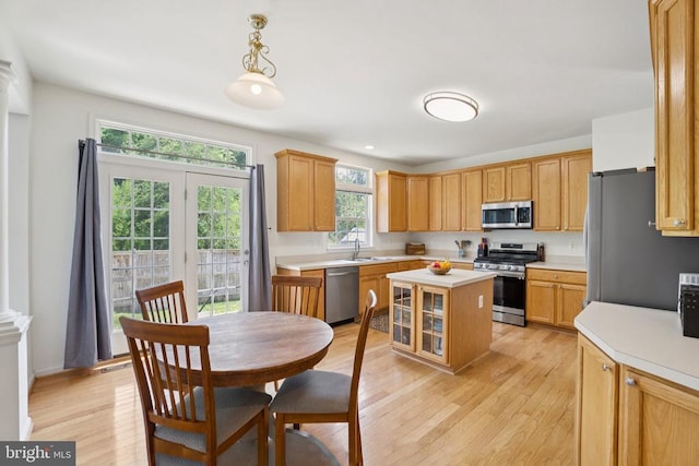 12314 Osprey Ln, Culpeper, VA 22701 - kitchen with appliances with stainless steel finishes, light countertops, light wood-type flooring, and a kitchen island