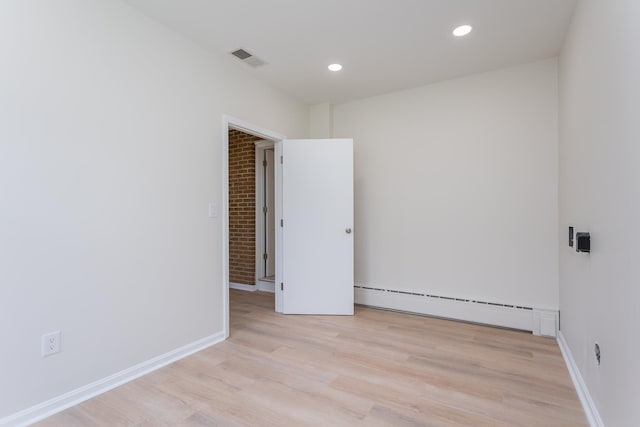 1002 Coalter St, Staunton, VA 24401 - unfurnished room with a baseboard heating unit, light wood-type flooring, recessed lighting, and baseboards
