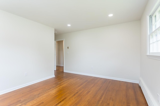 1002 Coalter St, Staunton, VA 24401 - empty room with wood finished floors, recessed lighting, baseboards, and baseboard heating