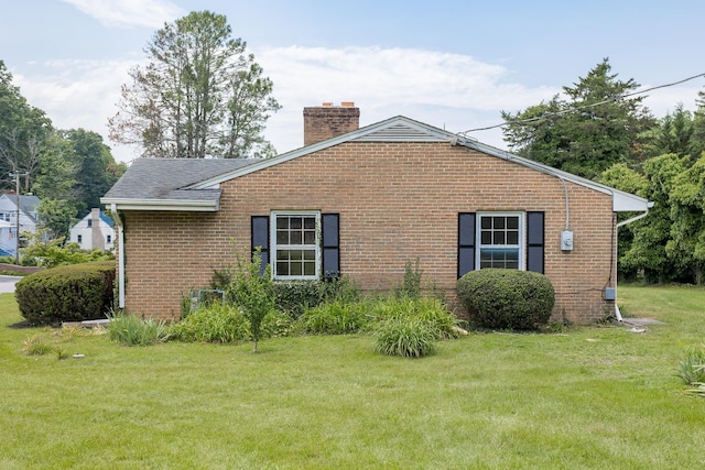 1002 Coalter St, Staunton, VA 24401 - view of side of property featuring a chimney, a yard, and brick siding