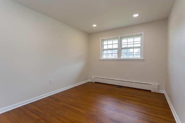 1002 Coalter St, Staunton, VA 24401 - empty room featuring wood finished floors, baseboards, recessed lighting, and baseboard heating