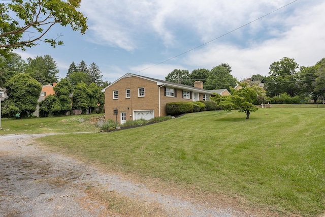 1002 Coalter St, Staunton, VA 24401 - view of side of property with a garage, brick siding, driveway, a chimney, and a lawn