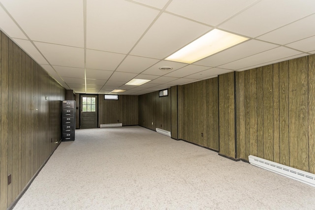 1002 Coalter St, Staunton, VA 24401 - below grade area featuring wooden walls, a paneled ceiling, light carpet, and a baseboard radiator
