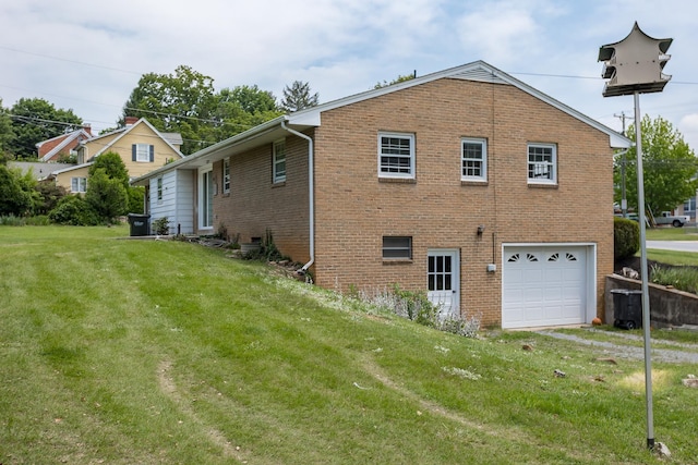 1002 Coalter St, Staunton, VA 24401 - view of side of property with a garage, brick siding, a lawn, and driveway