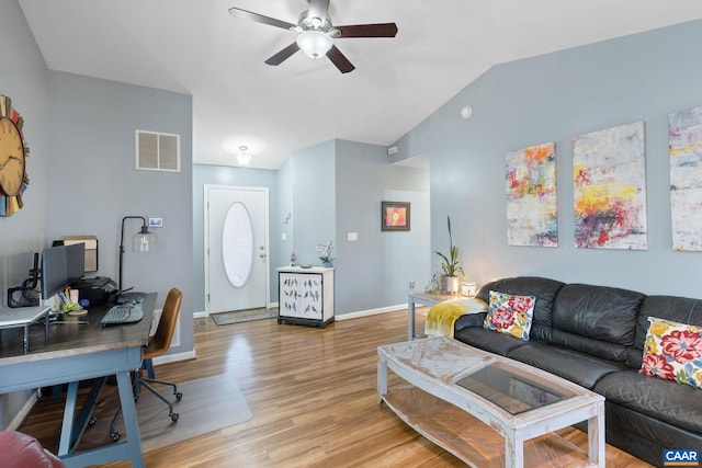 living area featuring a ceiling fan, baseboards, visible vents, vaulted ceiling, and wood finished floors