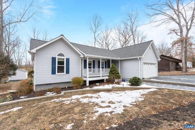 single story home with driveway, a porch, a shingled roof, and an attached garage