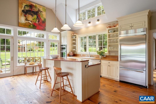 240 Broad Axe Rd, Charlottesville, VA 22903 - kitchen featuring a sink, open shelves, high vaulted ceiling, a kitchen island, and appliances with stainless steel finishes