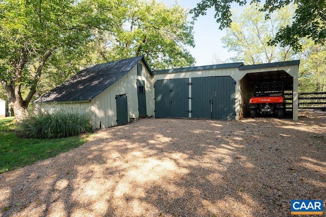 240 Broad Axe Rd, Charlottesville, VA 22903 - view of outbuilding with fence, a carport, an outbuilding, and driveway