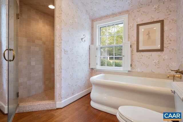 240 Broad Axe Rd, Charlottesville, VA 22903 - bathroom with a shower stall, baseboards, a garden tub, and wood finished floors