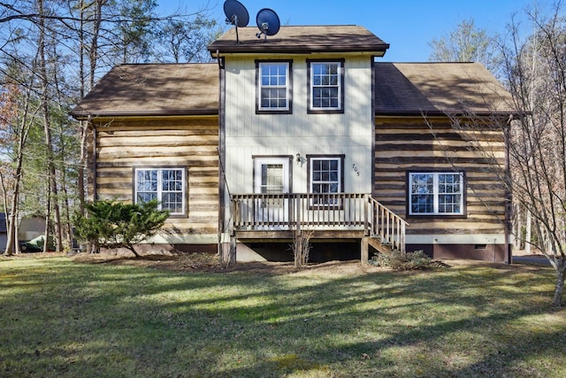 back of house with a yard, a shingled roof, and crawl space