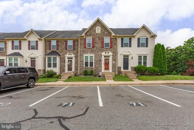 4556 Alliance Way, Fredericksburg, VA 22408 - view of property featuring stone siding and uncovered parking