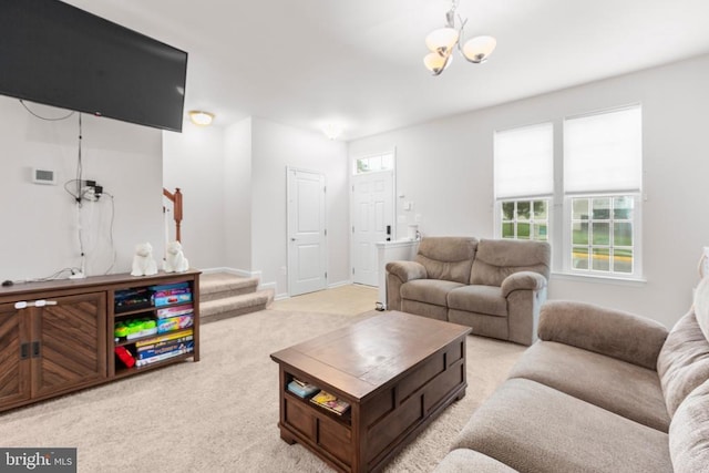4556 Alliance Way, Fredericksburg, VA 22408 - living area featuring light colored carpet, stairs, and a chandelier