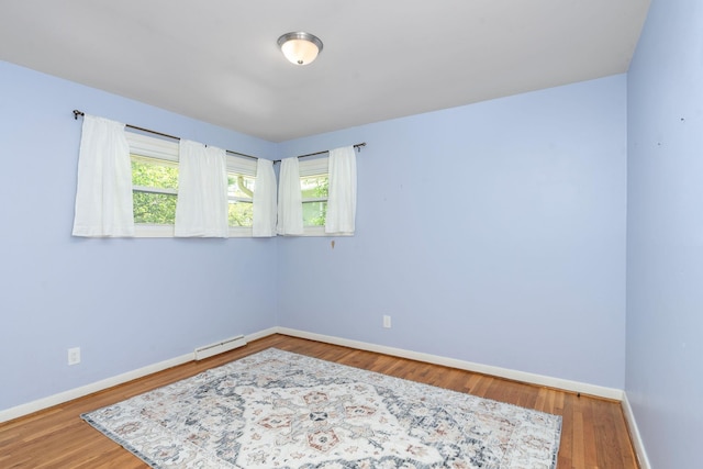 916 Selma Blvd, Staunton, VA 24401 - unfurnished room with wood finished floors and a baseboard heating unit