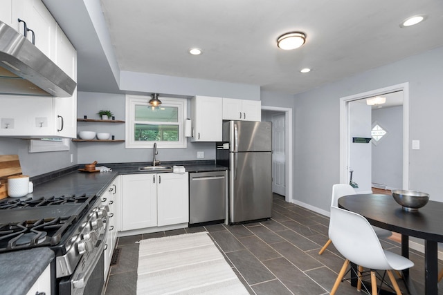 916 Selma Blvd, Staunton, VA 24401 - kitchen featuring appliances with stainless steel finishes, range hood, dark countertops, white cabinetry, and open shelves