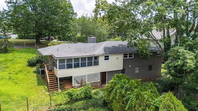 916 Selma Blvd, Staunton, VA 24401 - rear view of house featuring stairs, a sunroom, a chimney, a yard, and roof with shingles