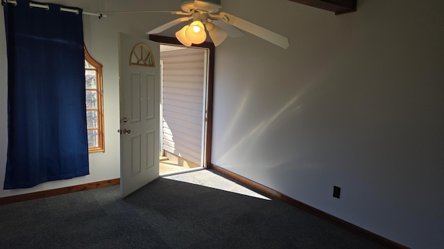 unfurnished room with carpet, baseboards, and ceiling fan