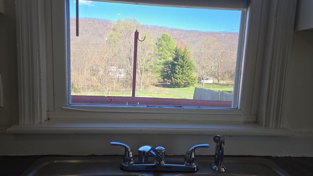 interior details featuring a sink and a mountain view