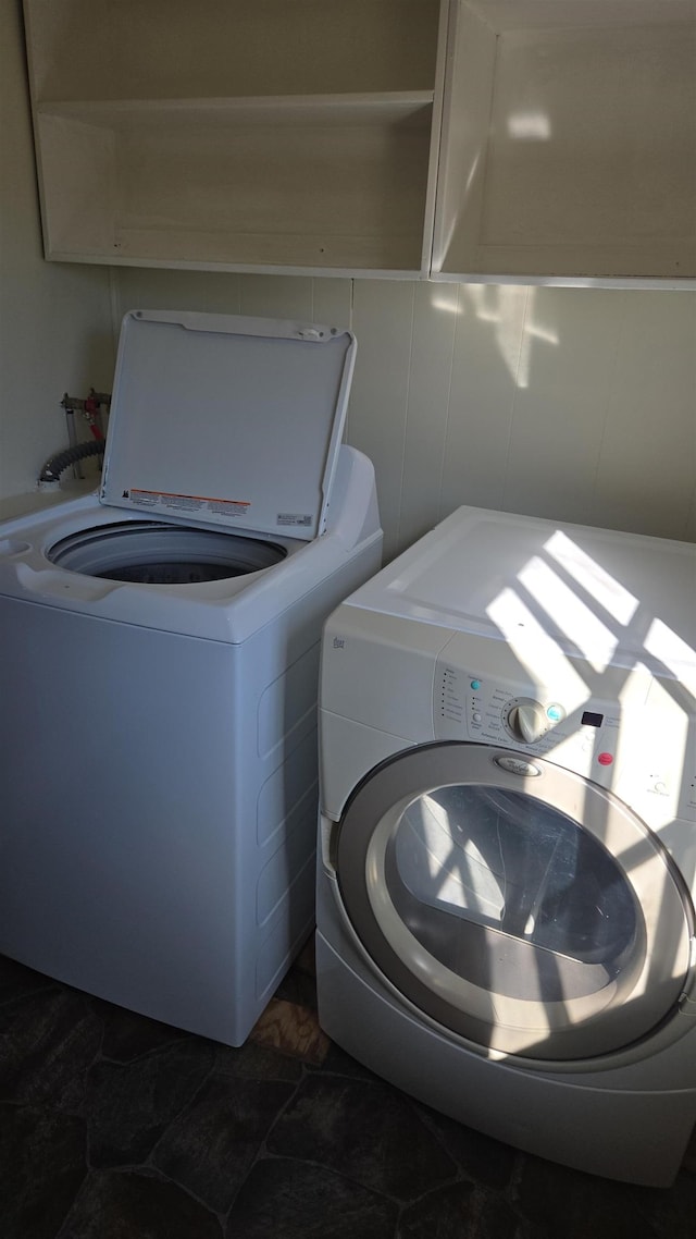 washroom featuring independent washer and dryer