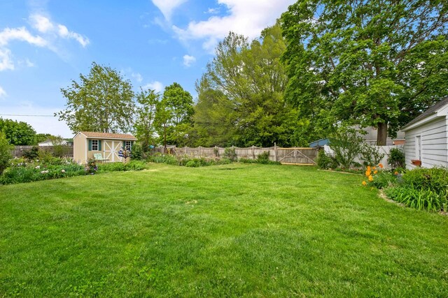 view of yard with a storage shed and an outdoor structure