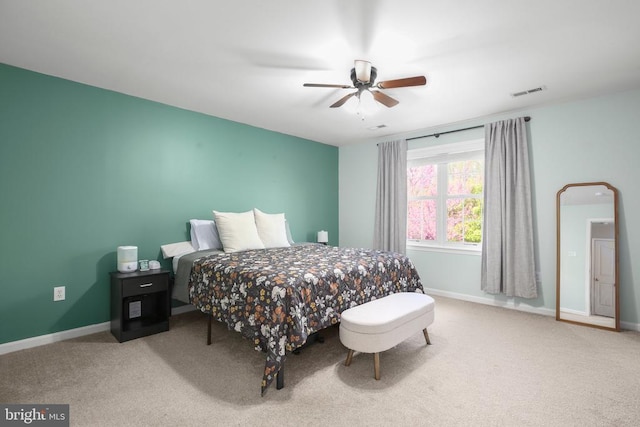 bedroom featuring visible vents, carpet flooring, baseboards, and ceiling fan