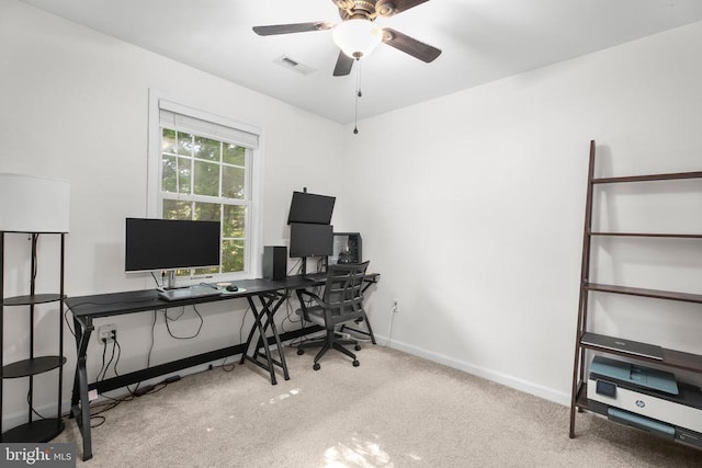 carpeted office with a ceiling fan, baseboards, and visible vents