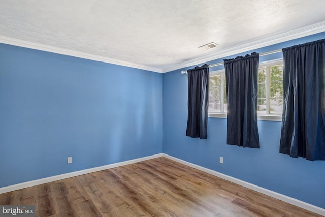 10603 Bluebird Ln, Spotsylvania, VA 22553 - spare room featuring wood finished floors and crown molding