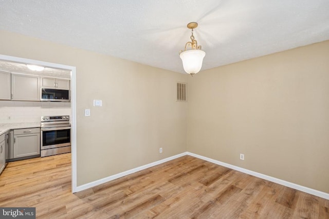 10603 Bluebird Ln, Spotsylvania, VA 22553 - unfurnished dining area with light wood-style floors