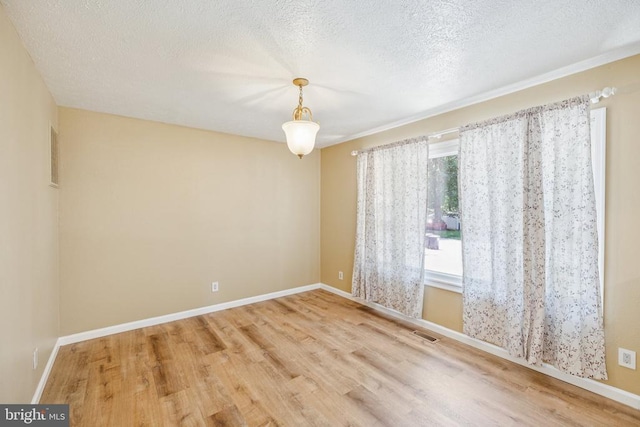 10603 Bluebird Ln, Spotsylvania, VA 22553 - empty room featuring wood finished floors and a textured ceiling