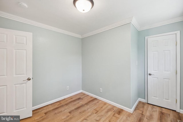 10603 Bluebird Ln, Spotsylvania, VA 22553 - spare room featuring wood finished floors, crown molding, and a smoke detector