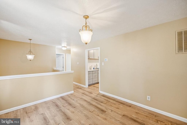 10603 Bluebird Ln, Spotsylvania, VA 22553 - spare room with light wood finished floors and baseboards