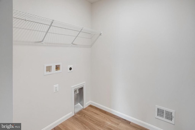 35663 Aspen Way, Locust Grove, VA 22508 - laundry room with electric dryer hookup, hookup for a washing machine, baseboards, and light wood finished floors