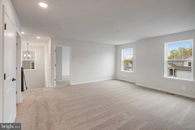 35663 Aspen Way, Locust Grove, VA 22508 - unfurnished room with a chandelier, light colored carpet, recessed lighting, plenty of natural light, and baseboards