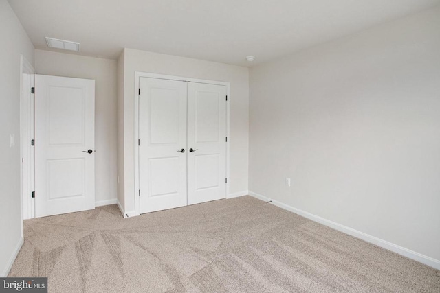 35663 Aspen Way, Locust Grove, VA 22508 - unfurnished bedroom with carpet flooring, a closet, and baseboards