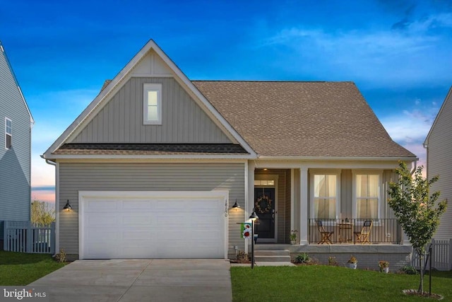 view of front of property with board and batten siding, a porch, driveway, roof with shingles, and a garage