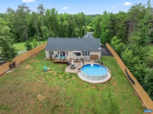 8289 Three Notch Rd, Louisa, VA 23093 - back of house featuring a wooden deck, a forest view, and a fenced backyard