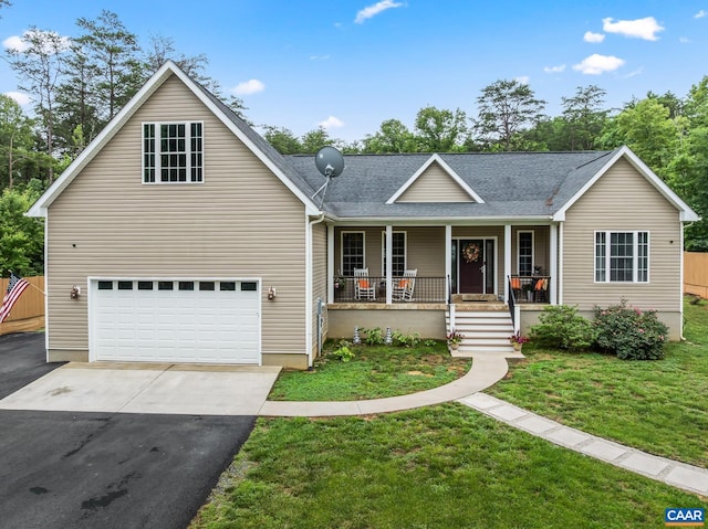 8289 Three Notch Rd, Louisa, VA 23093 - view of front of home with a porch, driveway, a garage, a front yard, and a shingled roof