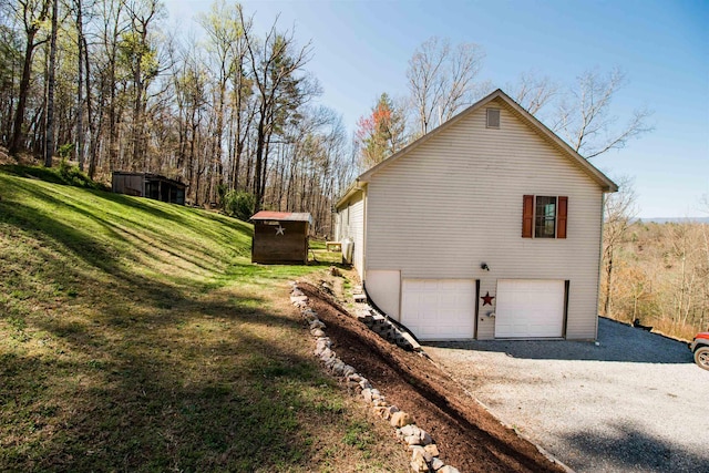 9839 Brunk Spring Ln, Broadway, VA 22815 - view of side of home with driveway, a garage, and a lawn